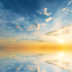 Wall Mural - Background sky during sunset and water reflections.