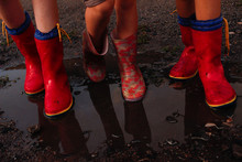 Children After The Rain With Rubber Boots