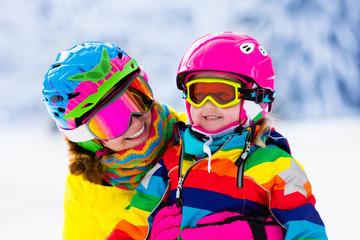 Wall Mural - Family ski and snow fun in winter mountains