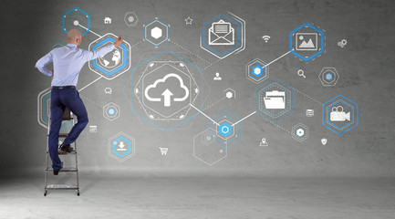 Poster - Businessman using cloud interface on a wall 3D rendering