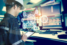 Double Exposure Of Engineer Or Technician Man With Business Industrial Tool Icons While Using Tablet With Monitor Of Computers Room  For Oil And Gas Industrial Business Concept