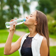 © Andrey_Arkusha - Portrait of young beautiful dark haired woman drinking water