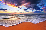 Fototapeta Łazienka - Beautiful sea wave and sky at sunset.
