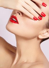 Wall Mural - Red lips and bright manicured nails. Sexy open mouth. Beautiful manicure and makeup. Celebrate make up and clean skin