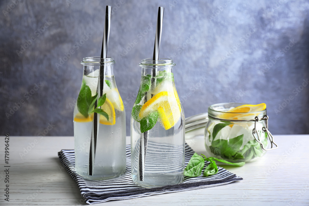 Basil water in glassware on table