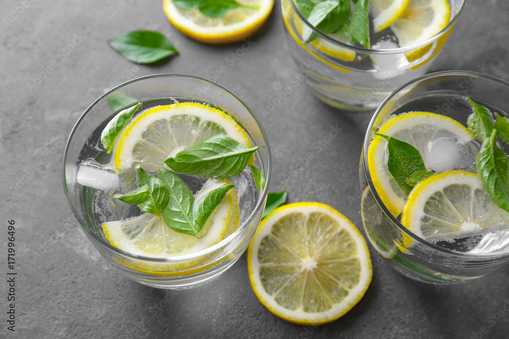 Composition with glasses of basil water on table