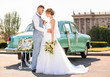 © Africa Studio - Happy wedding couple near decorated car outdoors