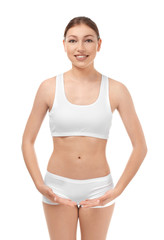 Wall Mural - Beautiful young woman in underwear on white background. Diet concept