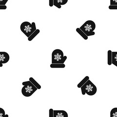 Wall Mural - Mitten with white snowflake pattern seamless black
