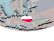 © harvepino - Poland with flag on globe
