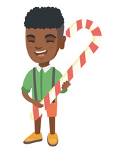 Canvas Print - Happy african-american little boy holding a christmas candy cane