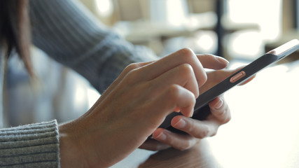 Close up of woman using mobile phone