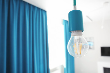 Wall Mural - Light bulb in modern room