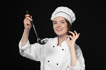 Sticker - Female chef with ladle on dark background