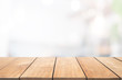 © BrightSpace - Empty wooden table and blurred people in cafe background, product display