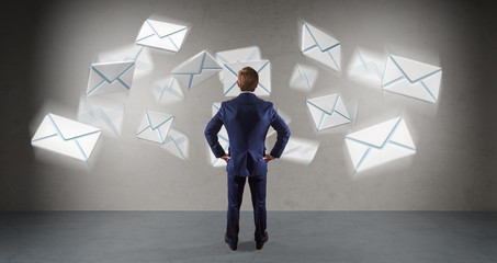 Wall Mural - Businessman using email interface on a wall 3D rendering