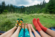 legs of a family of four outdoors