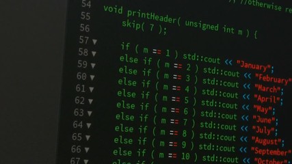 Wall Mural - programmer scrolling up and down and checking code for editing futuristic technology concept with gr