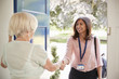 © Monkey Business - Senior woman greeting female care worker making home visit
