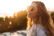 © Drobot Dean - Close up image of happy brunette woman in sunglasses
