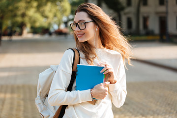 Sticker - Image of Happy brunette woman in eyeglasses and autumn clothes