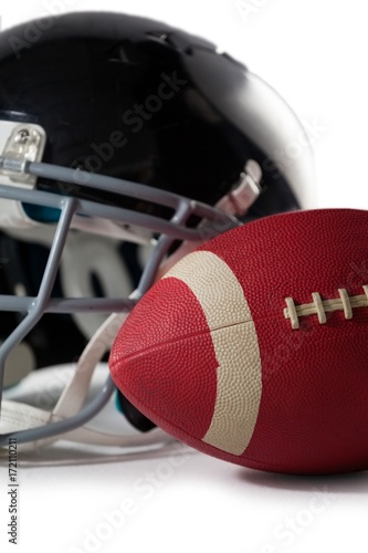Close up of American football with sports helmet