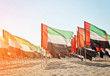 Celebration of National Day - Day of the United Arab Emirates, Large number of flags of the United Arab Emirates on the sand, toned