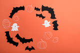 Fototapeta Dinusie - Frame of haloween symbols on red background for logo and text