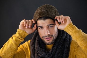 Wall Mural - Man posing against black background