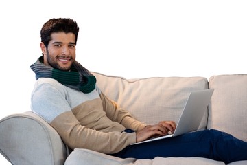 Wall Mural - Portrait of smiling man using laptop