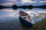 Fototapeta  - Blue kayak at the lake