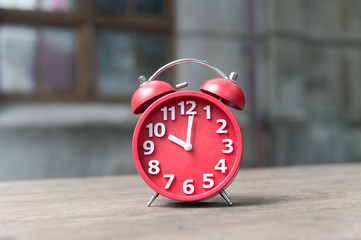 modern clock on wood table 