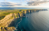 Fototapeta Nowy Jork - Aerial birds eye drone view from the world famous cliffs of moher in county clare ireland. Scenic Irish rural countryside nature along the wild atlantic way.