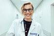 Leinwandbild Motiv Female doctor standing in hospital corridor