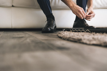 Man lacing his shoes