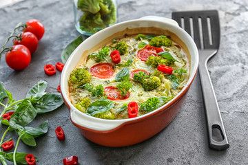 Wall Mural - Baking dish with broccoli casserole on table