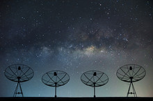 Satellite Dishes On Building For Telecommunication With Milky Way Sky Background