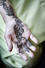 A Hand With A Painted Henna Tattoo