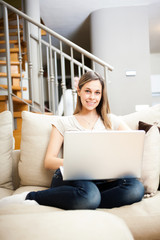 Wall Mural - Woman using a laptop