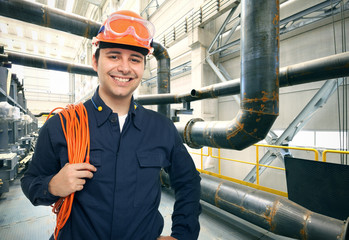 Portrait of a smiling worker in a factory