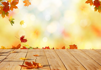 autumn maple leaves on wooden table.falling leaves natural background.
