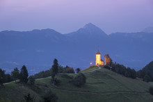 The Iconic Jamik Church, With Mount Triglav On The Background. Jamnik, Kranj, Upper Carniola, Slovenia.