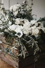 Flowers And Greenery In Wooden Crate