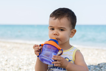 Baby boy drinking water