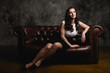 © Анна Антонова - beautiful woman sitting on sofa