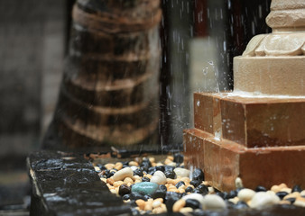 Canvas Print - Beautiful fountain with pebbles outdoors, closeup