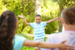 © Africa Studio - Young family with adopted African American boy outdoors