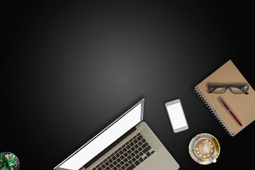 Modern dark surface office desk table with computer and cup of coffee. Hero Header Concept with Copy space.	