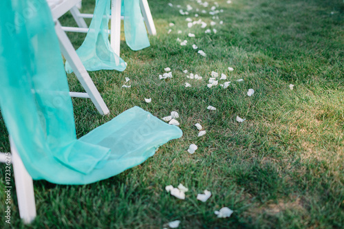 Mint Cloth Hangs From White Chair On The Lawn Buy This