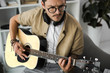 © LIGHTFIELD STUDIOS - man playing guitar